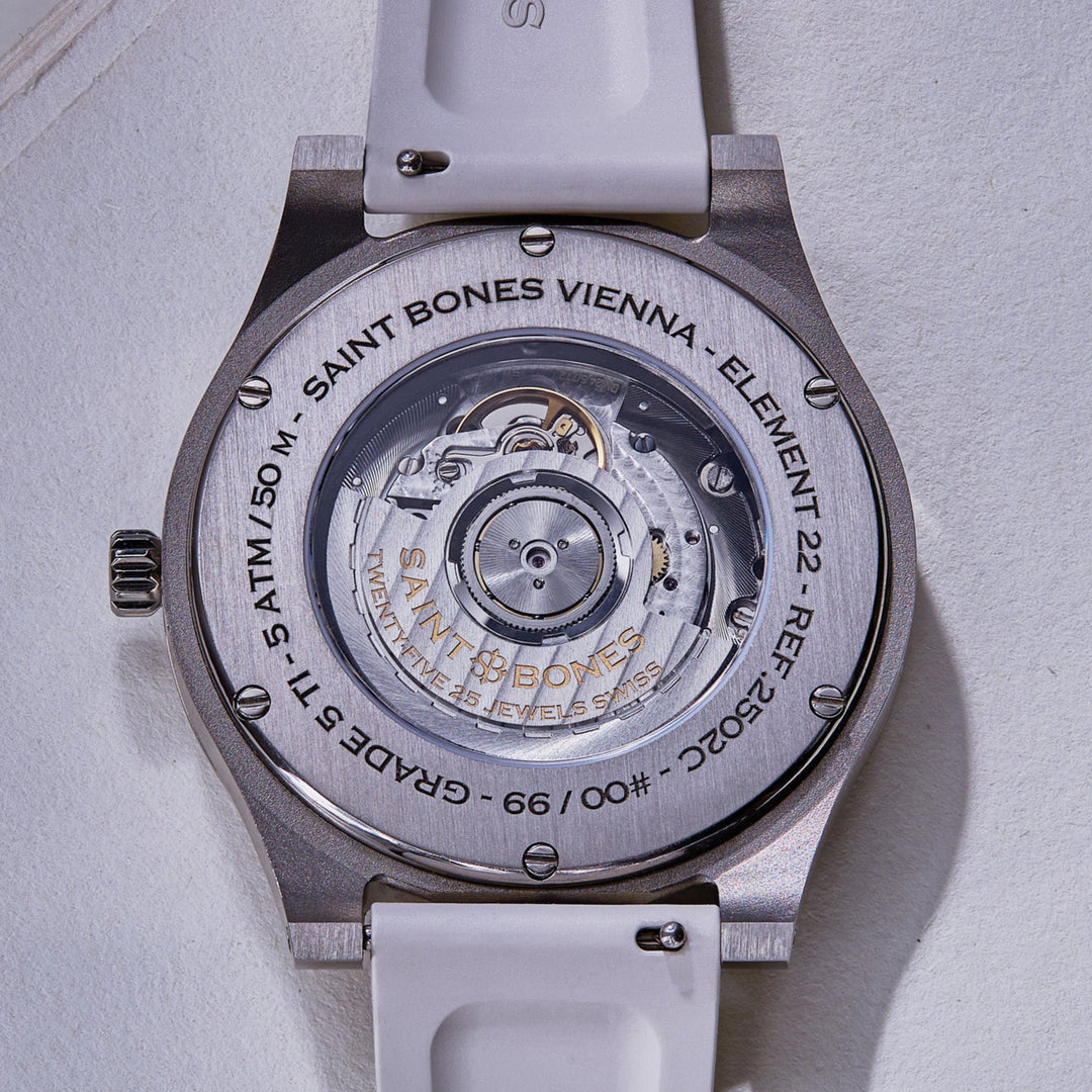 Watch case with visible brand name on a light gray background