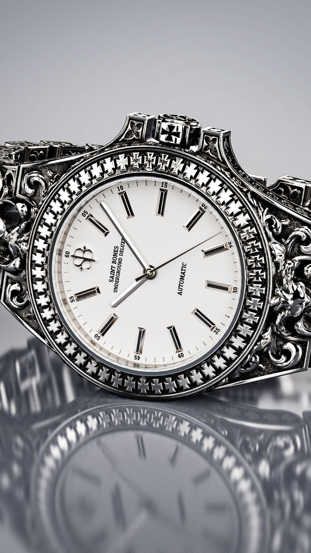 Decorative silver watch on a reflective surface with a gray background