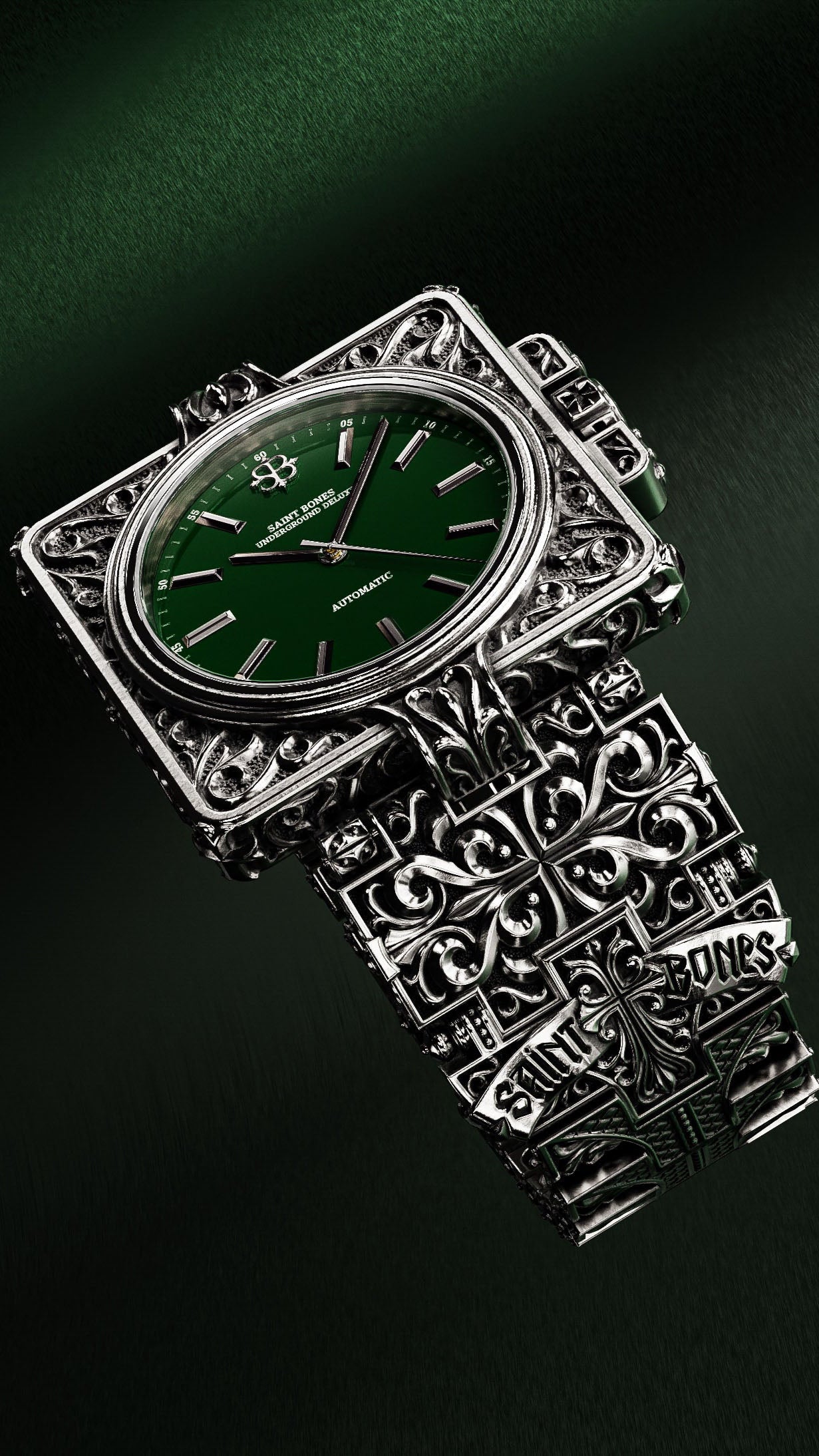 Silver watch with a green face on a dark background